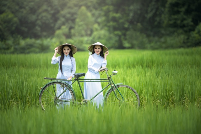 2 Asian woman with bike